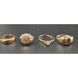 A group of four rings, 9 K yellow gold, including one with a half sovereign, one with diamonds,