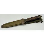 WWII US M3 Fighting Knife with US M8A1 Scabbard by T.W.B. Manufactured at the top of the pommel is