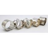 5 VINTAGE SILVER NAPKIN RINGS. 144.4gms