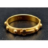 A 21 K yellow gold ring with a central cross motif and knobs all round. ring size: S, weight: 5.9 g.