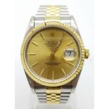 A gents ROLEX Oyster Perpetual Datejust, stainless steel and 18 K yellow gold watch, 1995 model.