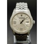 A gents ROLEX Datejust stainless steel watch. 36 mm dial with diamond bezel and champagne coloured
