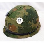 Vietnam War Era US M1 Helmet and liner. Complete with a reversible Mitchel/Duck Hunter cover.