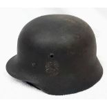 WW2 German M40 Helmet. With liner and fragile chinstrap. Remains of a single decal can be seen.