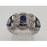 An Art Deco, 18 K white gold (hallmarked) sapphire and diamonds ring. Excellent condition. Ring