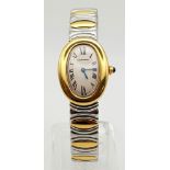 A rare, Cartier, curved, 18 K yellow gold watch, with stainless steel bracelet. 22 x 30 mm dial,
