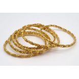Six bangles, 20 K yellow gold, with the same design. Total weight: 99.9 g