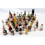 50 MINATURE BOTTLES OF INTERESTING ALCOHOLIC DRINKS .