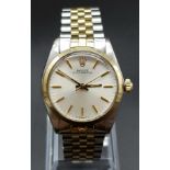 A unisex ROLEX Oyster Perpetual stainless steel and 18 K yellow gold watch. 31 mm dial, white face
