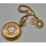 A Vintage 9K Gold Half-Hunter Pocket Watch - With a 9K Gold Fob. Also attached is a silver medal.