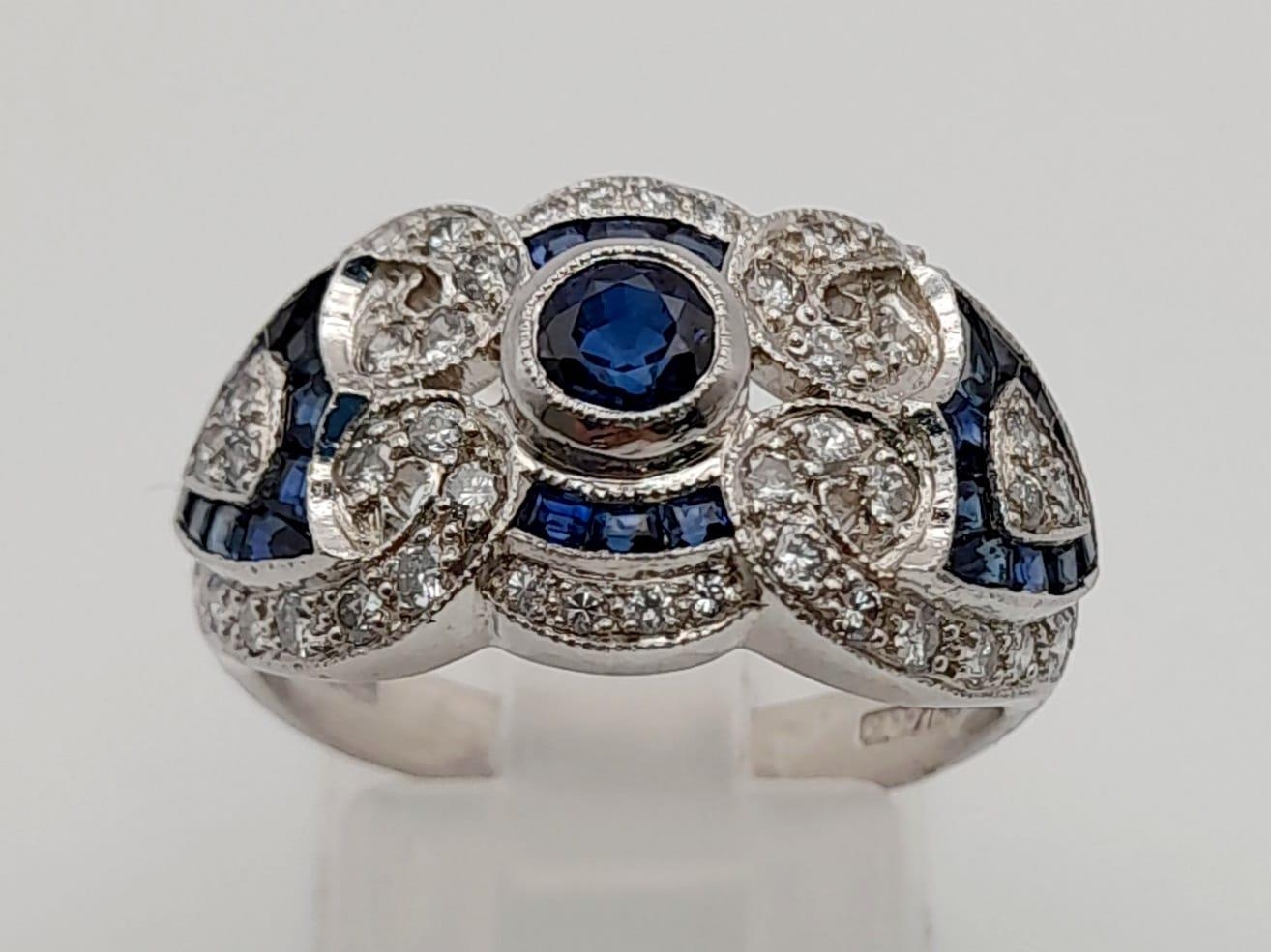 An Art Deco, 18 K white gold (hallmarked) sapphire and diamonds ring. Excellent condition. Ring