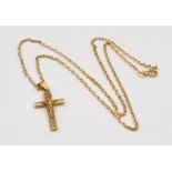 A 9K yellow Gold Crucifix on a 9K Yellow Gold Belcher Link Necklace. 25mm and 44cm. 3.33g.