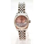A ladies ROLEX Oyster Perpetual Datejust, stainless steel watch. 26 mm dial, pink face with