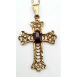 A 9K Yellow Gold Cross with Garnet Centre Stone on a 9K Yellow Gold Disappearing Necklace. 25mm