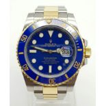 A gents ROLEX Oyster Perpetual Date, Submariner, stainless steel and 18 K yellow gold watch. 40 mm