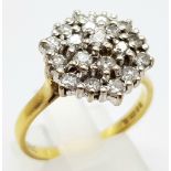 AN 18K GOLD 19 STONE DIAMOND CLUSTER RING WITH 1.5CT DIAMONDS. 5.4gms size R