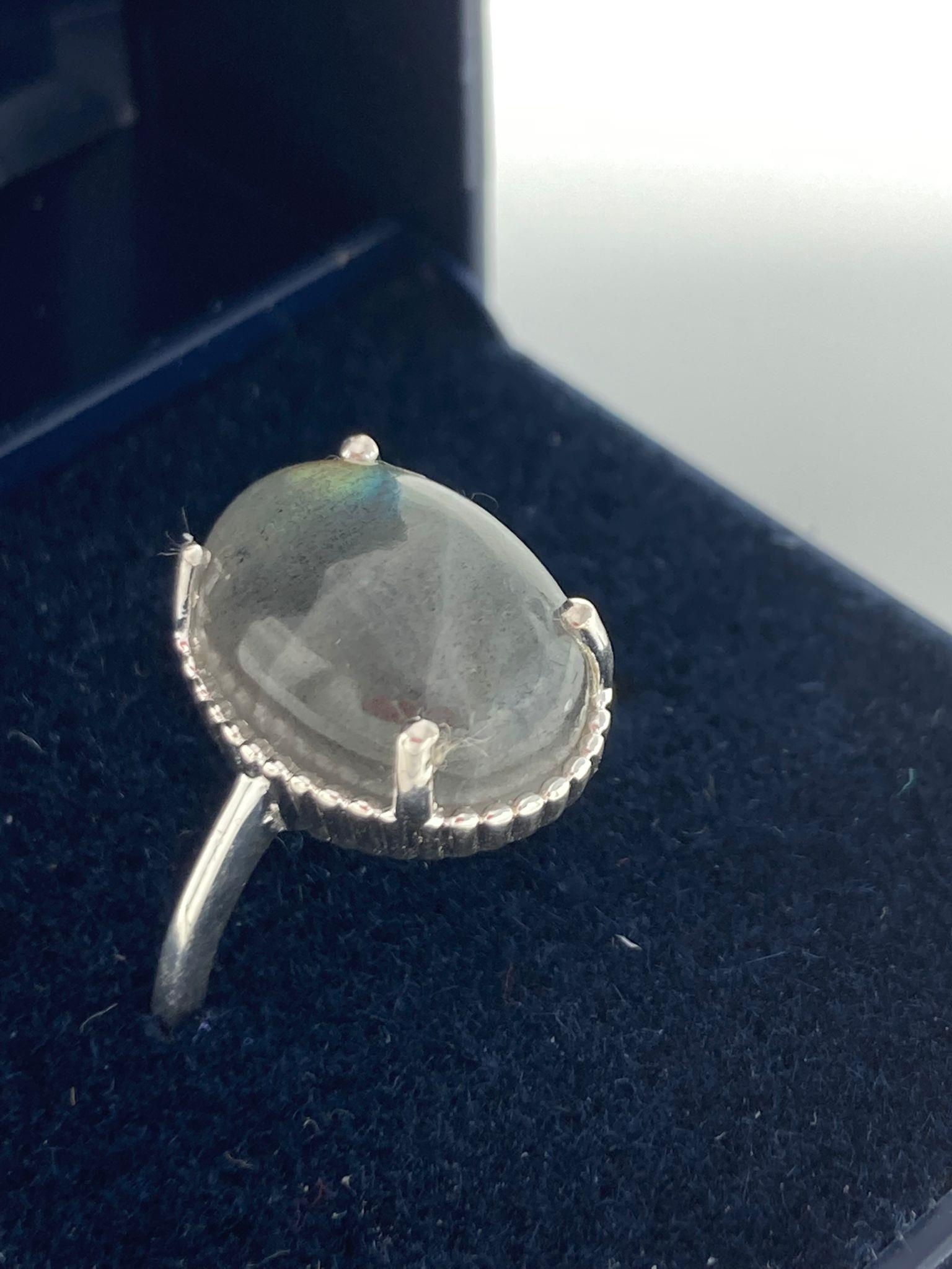 SILVER RING with GREY MOONSTONE mounted to top.Unworn condition and presented in jewellers ring box.