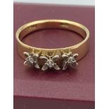 18 carat GOLD and diamond ring having three diamonds individually mounted in Palladium to top. 2.