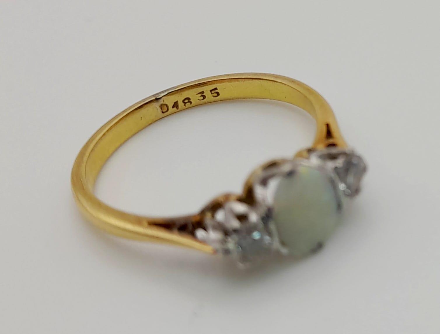 An 18 K yellow gold ring with an opal cabochon and two brilliant cut diamonds. Ring size: L, weight: - Image 4 of 4