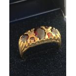 9 carat GOLD RING set with GARNETS. Small stone missing. 2.6 grams. Size M 1/2 - N.