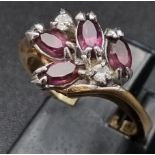 A gold plated ring with amethysts and cubic zirconia. Ring size: M