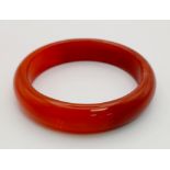 A Red Jade Bangle. Inner diameter - 6cm.