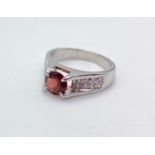 A Garnet and 925 Silver Ring. Size O. 5g