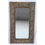 An Early Brass Embossed Mirror in Immaculate Condition. 21 x 38cm.