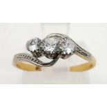 A 9K Yellow Gold Three-Stone Diamond Crossover Ring. Size M. 1.83g total weight.