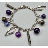 A Sterling Silver and Amethyst Charm Bracelet. 18cm 20g