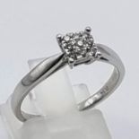 18K WHITE GOLD SQUARE DIAMOND CLUSTER RING. 0.19CT. SIZE O. 3G