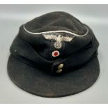 Late War German Panzer Officers M43 Cap. Good condition for its age.
