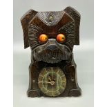 A Wonderful 1930s Black Forest Scotty Dog Rolling Eye Clock. In working order but temperamental,