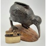 An Early Rare and Unusual Kiwi Bird Figurine Table Lighter. Patinated metal decoration on a wood