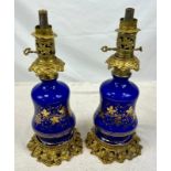A Pair of Antique Cobalt Blue Ceramic and Ornate Gilded Lamps. 48cm tall. Good condition but A/F.