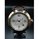 CARTIER AUTOMATIC GOLD AND STEEL WATCH WITH ROUND FACE AND SKELETON BACK ON LEATHER STRAP. 38mm