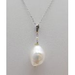 A Large Natural Baroque Pearl Pendant on a 9K White Gold Disappearing Necklace. 2 and 46cm. 3.45g
