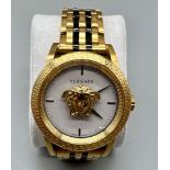 A very stylish VERSACE gents watch. Lavishly gold plated, with 43 mm dial and the emblematic