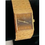 Vintage ROTARY ladies midi size wristwatch in gold tone with wide gold tone brickwork bracelet.