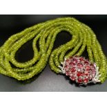 A 5 rows of 440cts Peridot Gemstone Choker, 16 inches long with a Garnet Clasp set in 925 Silver