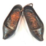 Pair of Dutch clogs that have been crudely engraved by a German soldier to mark the successful