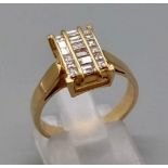 An 18K Yellow Gold Diamond Three-Channel Set Ring. 18 diamonds in total. Size M. 5.13g total weight.