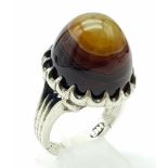 A LARGE AGATE DRESS RING SET IN SILVER. 22.4gms size W