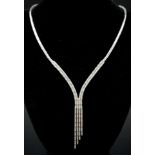 A Vintage 18K White Gold Diamond Tassel Necklace. Bar links leading to diamond bar links and finally