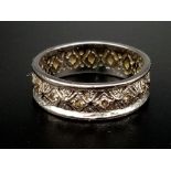 An 18K White Gold Geometric Patterned Diamond Eternity Ring. Size O. 5.6g.