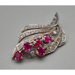 An 18K White Gold Diamond and Burmese Ruby Brooch. 4.5cm. 8.22g total weight.