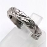 A Hand-Made Platinum and Diamond Band Ring - In an arts and crafts Cartier style. Size M. 8.91g