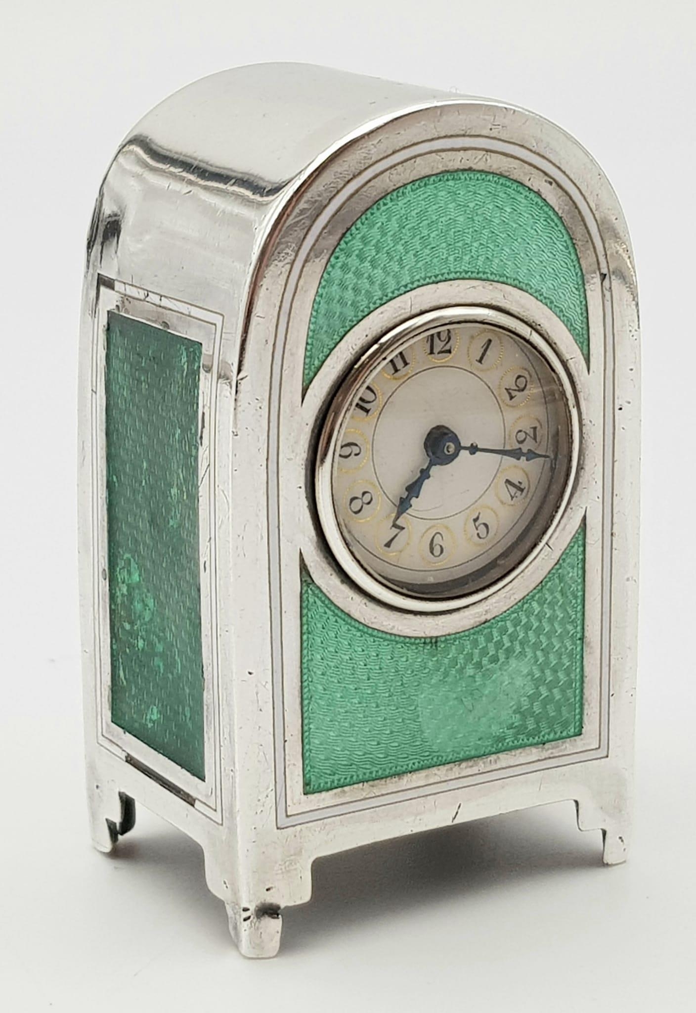 An Antique Solid Silver Enamel French Miniature Clock. Arch design with a green enamel front and