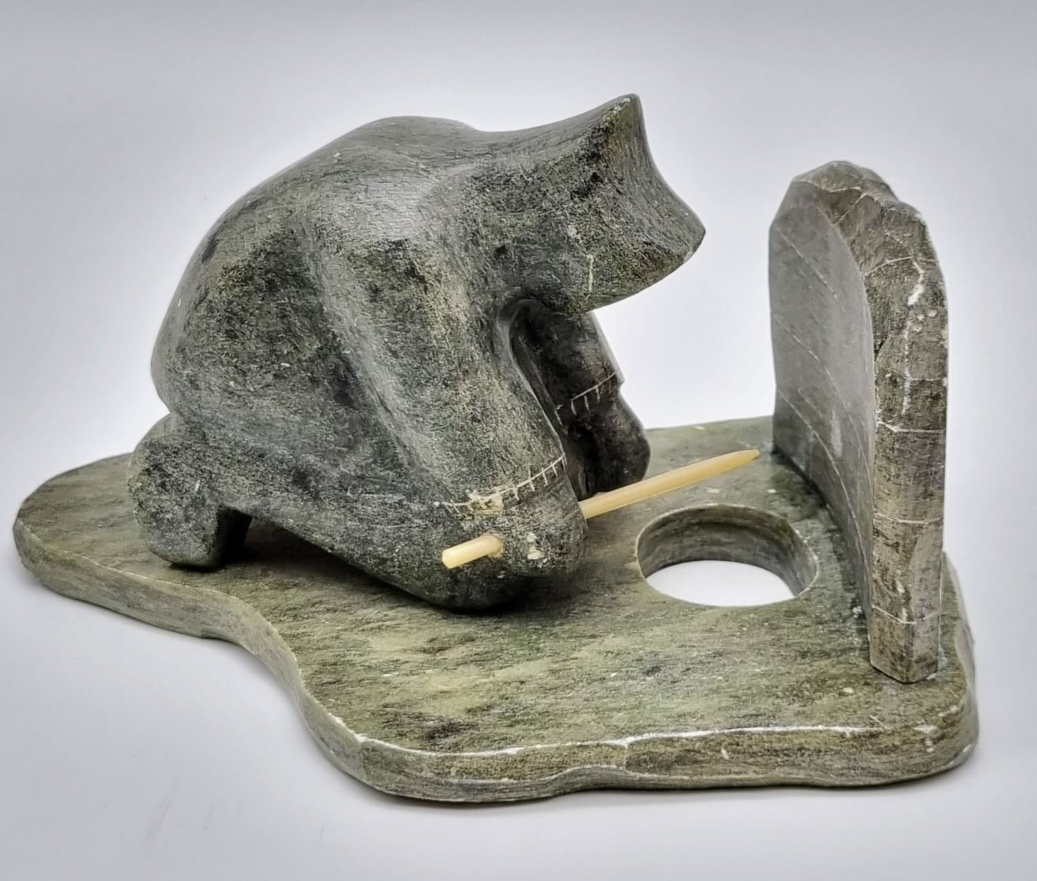 An Antique Newfoundland and Labrador Inuit Soapstone Hand-Carved Figure of an Ice Fisherman.