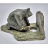 An Antique Newfoundland and Labrador Inuit Soapstone Hand-Carved Figure of an Ice Fisherman.
